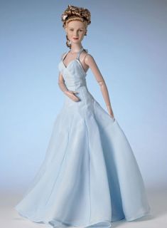 Mary Jane wears a chiffon layered gown with godets in the skirt based