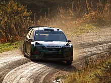 Jari Matti Latvala on the muddy gravel roads of the 2007 Wales Rally